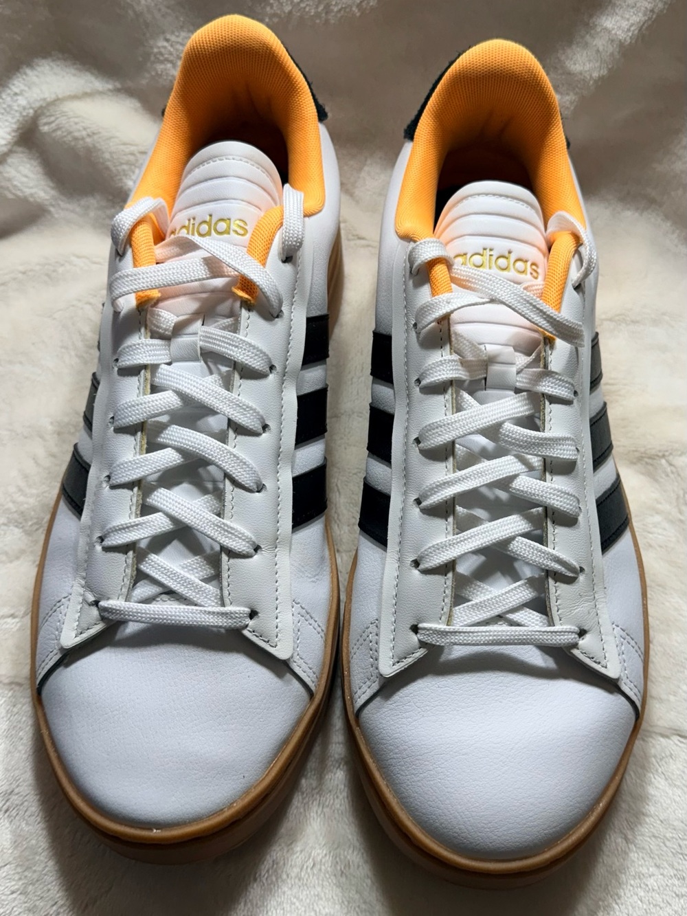 Adidas White Sneakers with Black Stripes and Yellow Lining